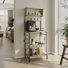 a coffee maker is on top of a shelf in the corner of a living room