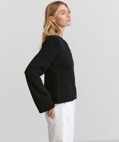 Cooper Cardigan Black Featuring a structured hourglass silhouette and a very slight bell sleeve, this chic knit is unlike anything we’ve done before. Ultra-soft wool cashmere and a classic shape are easily styled with everything from wide-leg trousers to your favorite skirt. 70% wool, 30% cashmere. Made in China of Peruvian yarn. Fitted button-down cardigan. | Jenni Kayne Women's Cooper Cardigan Sweater Size X-Small Chic Tailored Long Sleeve Cardigan, Chic Fitted Cardigan With Button Cuffs, Tailored Elegant Winter Cardigan, Formal Fitted Cashmere Cardigan, Elegant Tailored Cardigan For Winter, Elegant Tailored Winter Cardigan, Elegant Winter Cardigan, Tailored Chic Cardigan For Fall, Chic Tailored Cardigan For Fall