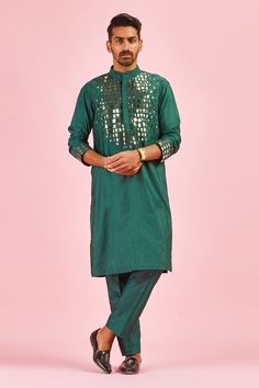 Green kurta with geometric motifs in thread, acrylic embroidery and mandarin collar. Paired with pant.
Component: 2
Pattern: Embroidered
Type Of Work: Acrylic and Thread Mix
Neckline: Mandarin
Sleeve Type: Long Sleeves
Fabric: Cotton Silk
Color: Green
Other Details: 
Acrylic and thread work
Occasion: Sangeet,Mehendi and Puja - Aza Fashions Red Kurta, Kurta For Men, Kurta Set For Men, Men's Kurta, Ethnic Outfits, Indian Fashion Designers, Kurta Set, Green Silk, Embroidered Silk