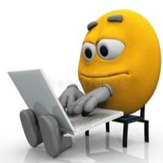 a yellow smiley face sitting on top of a laptop computer