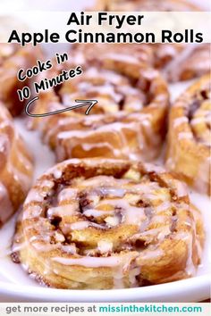 some cinnamon rolls on a white plate with text overlay that reads air fryer apple cinnamon rolls