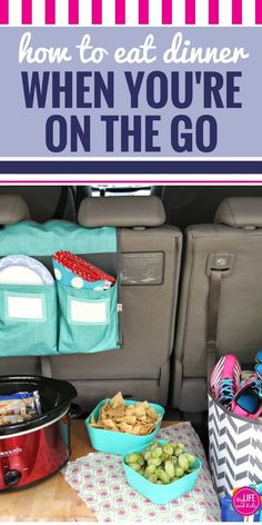 the back seat of a car with food and snacks in bowls on the floor next to it