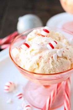 a bowl filled with ice cream and candy canes