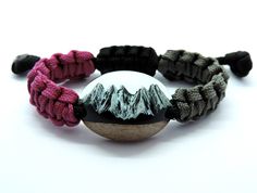 Mountain resin bracelet for mountaineering & hiking lovers. Incredible mountain landscape in a miniature world. Great gift idea for yourself or someone you love. Made of walnut wood, epoxy resin and paracord rope. If you want a different color combination please let me know. Amazing appearance and quality. Mountain total length: approx 3.3 cm (1.29 in). The length of bracelet is fully adjustable. Feel free to contact if you have any questions - I will gladly reply. MORE RESIN JEWELRY: www.etsy.com/shop/TomKinArt * SHIPPING * Only 1. class shipping FREE SHIPPING with €50 ($58) purchase. * ESTIMATED DELIVERY TIME * Europe: 6-9 days North America: 8-13 days Asia, Australia and South America: 10-16 days. Please note these are only estimated delivery times and can occasionally be subject to del Paracord Rope, Miniature World, Wood Epoxy, Mountain Necklace, Resin Bracelet, Hiking Gifts, Resin Necklace, Mountaineering, Mountain Landscape