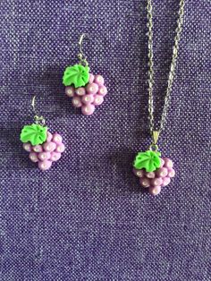 (11,707) Grapes Necklace or Earrings  Made from polymer clay, 7/8" x 5/8" Earrings on stainless steel ear wires  Necklace on 18" stainless steel chain  Much prettier in person. Nickel-free Pink Polymer Clay Jewelry, Purple Dangle Polymer Clay Jewelry, Nickel-free Polymer Clay Dangle Jewelry, Hypoallergenic Dangle Polymer Clay Jewelry, Hypoallergenic Polymer Clay Jewelry Gift, Cute Purple Resin Jewelry, Jewellery Sets, Wire Necklace, Clay Necklace