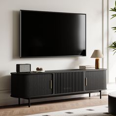 a flat screen tv mounted to the side of a wall