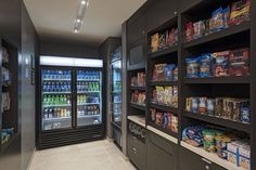 a grocery store filled with lots of food and drink coolers next to each other