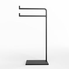 a black metal floor lamp on a white background with clippings to the side