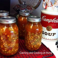 three jars filled with food sitting on top of a counter next to a canister