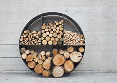 a metal tray filled with lots of cut logs