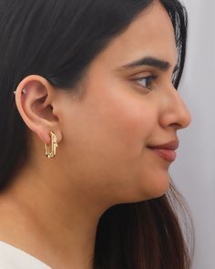 Handcrafted by skilled Jaipur artisans, the Monroe earrings detail their squared hoop design with organic dripping motifs that capture the fluid brilliance of erupting volcanoes. From Preeti Sandu’s Molten Collection, bespoke pieces inspired by the mesmerizing flow of fiery, glassy lava. Hinge closure 14k gold-plated sterling silver Polish with soft cloth Handcrafted in India Measurements Length: 1.1in | Preeti Sandhu Women's Monroe Link Hoop Earrings in Gold Silver Polish, Hoop Design, Gold Plated Sterling Silver, Jaipur, Gold Earrings, Bespoke, Gold Plate, Hoop Earrings, Plating