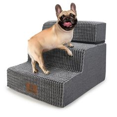 a small dog standing on top of two pet stairs that are made out of woven material