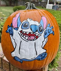 a pumpkin decorated with an image of a cartoon character