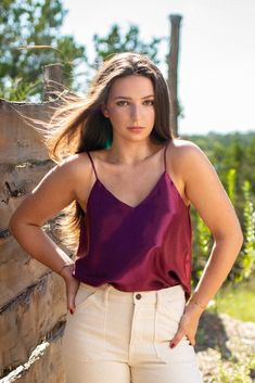 This stunningly reflective material is sure to turn some heads! Available in a metallic Maroon or a Dusty Blue, this sleeveless blouse features a v-neck cut on the front and back, spaghetti straps, and a flowing fit, perfect for flattering the waistline! 100% Polyester Credits: Kimberly Domangue Photography, LLC. ; "The Glamp" by Skybox Cabins Reflective Material, New Tops, Fall Collections, Sangria, Dusty Blue, Sleeveless Blouse, Short Pants, Bottoms Pants, Denim Skirt