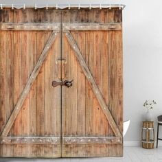 an old wooden door is shown in this photo shower curtain set with hooks on the side