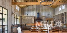 a large wooden dining room table surrounded by chairs