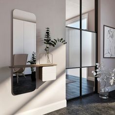 a room with a desk, mirror and plant in it