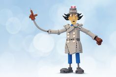 a toy soldier holding a small plane in one hand and pointing to the sky with his other