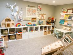 a child's playroom with toys, bookshelves and other items in it