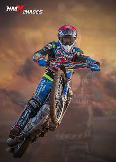 a man riding on the back of a dirt bike in mid air with clouds behind him