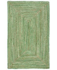 a green rug with an oval design on the center and two rows of lines in the middle