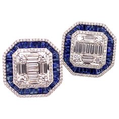 This is a stunning pair of blue sapphire and diamond earrings that has a subtle vintage appeal. It is carefully crafted with round brilliant and baguette diamonds that form the foundation of the earring while the blue sapphire is carefully placed to give a stunning accent. These straight post earrings will be a major hit at your next luncheon or social event! Sapphires: 5.1 cts. Baguettes Diamonds: 3.13 cts. Round Brilliant & Baguette Cut Metal: 18k White Gold Luxury Baguette Cut Earrings For Party, Luxury Blue Diamond Earrings With Brilliant Cut, Luxury Blue Diamond Earrings, Luxury Blue Baguette Cut Earrings, Luxury Blue Diamond Earrings With Accents, Blue Sapphire Diamond Earrings Gia Certified, Blue Diamond Earrings With Diamond Accents, Blue Diamond Earrings With Accents, Blue Diamond Earrings With Pave Setting