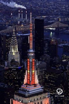 an aerial view of the empire building in new york city at night with lights on