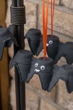 halloween decorations with bats hanging from them