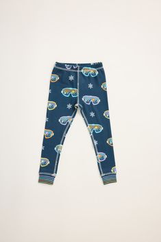 This item is Final Sale. Embrace winter fun in our kids' two-piece pajama set. Featuring a playful snow goggle print on a gender neutral navy backdrop. The elastic waist pant ensures a comfortable fit, making it easy to move around during playtime or while lounging. Soft and cozy, this set offers both style and warmth, making bedtime something to look forward to. Ideal for snowy nights or frosty mornings! Navy Backdrop, Elastic Waist Pants, Sleepwear & Loungewear, Winter Fun, Pj Sets, Waist Pants, Egift Card, Goggles, Pajama Set