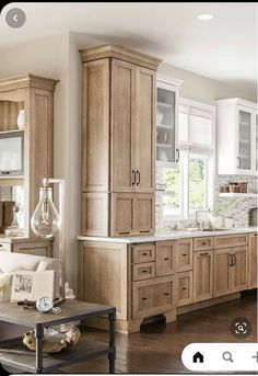 a kitchen filled with lots of wooden cabinets