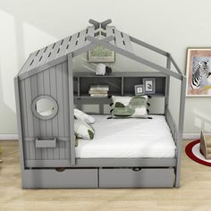 a child's bed with an animal themed house on the top and bottom bunk