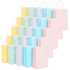 small pastel colored shopping bags are lined up in a row on a white background