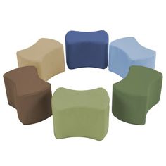 a group of different colored chairs sitting next to each other on top of a white floor