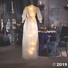 a dress with lights hanging from it's back