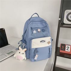 Features:

Be excited to go back to school this year with our new Multi Pockets Large Capacity Nylon Backpacks

Made with the most durable and waterproof nylon material, perfect for everyday use. Wear this as an adorable shoulder bag or backpack! 
Comes in 5 beautiful colors and adorable pins and a keychain to easily complement any of your cute school uniform/outfits 
Dimensions: 43cm x 32cm x 11cm Cute School Uniform Outfits, Stylish College Bags, Cute School Uniform, Girly Backpacks, Vestidos Anime, Uniform Outfits, School Uniform Outfits, White Backpack, Go Back To School