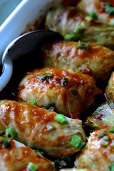 a close up of some food in a pan with a spoon on top of it