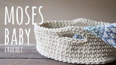 a crochet basket is shown with the words moss baby written in front of it