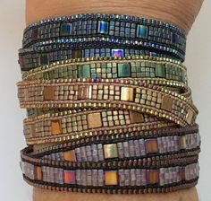 a woman's arm with several bracelets on it