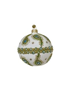 a white ornament with green and blue beads on it's side, against a white background