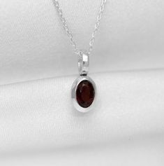 Stunning Red Garnet 925 Stamped Sterling Silver Pendant Size: 13mm x 6mm Stone Size: 6mm x 4mm Comes beautifully presented in a Gift Box and Bag Can be purchased with or without chain, please select from drop down menu Please note: Because these beautiful pieces are handmade, each piece is unique and therefore no two items are exactly the same.   Also, because the stones are all unique, stone colours/patterns may vary slightly. If you do not require the packaging (gift box, gift bag etc) then please leave a note at checkout and i will not include it.! Garnet Pendant, Jewellery Gift, Garnet Gemstone, Fine Jewellery Necklace, Red Garnet, Precious Gemstones, Silver Pendant Necklace, Jewelry Gift Box, Sterling Silver Chains