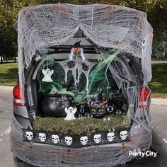 the trunk of a car decorated with halloween decorations