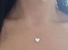 14K SOLID WHITE GOLD HEART NECKLACE Here is a dainty, delicate and simple, yet classy minimalist Heart Necklace.This is a 14k Solid White Gold open back heart necklace. (We do not sell filled or plated jewelry) Perfect for everyday use. Also available in 14k Yellow Gold. https://www.etsy.com/listing/749228903/14k-yellow-gold-heart-necklace?ref=listings_manager_grid Metal : 14K Solid Gold Necklace Length : 17 inches / 42.5cm Pendent Height : 9.10mm Pendant Width : 10.00mm Shipping Policy Item wil White Gold Heart Necklace, Yellow Gold Heart Necklace, Dainty Heart Necklace, Engraved Heart Necklace, Classy Minimalist, Tiny Heart Necklace, Mens Gold Wedding Band, Solid Gold Necklace, White Gold Wedding Bands