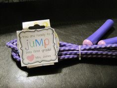 a purple jump rope with two pink markers on it and a card that says you are ready to jump into first grade