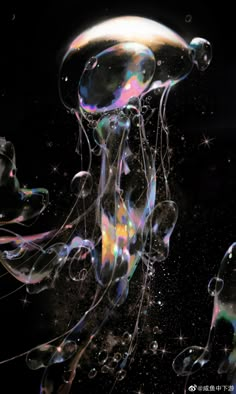 an image of jellyfish floating in the air with bubbles on its head and body