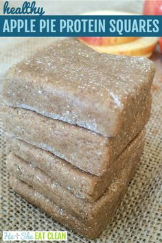 a stack of apple pie protein squares sitting on top of a table next to an apple