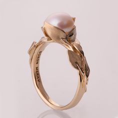 A handmade 14k gold leaves ring set with a pearl.  This ring in the picture is set with a 8.4mm pearl but can be set with any stone you choose, please contact me for a quote.  This engagement ring can be worn as a set with the leaves wedding band, available at - https://www.etsy.com/listing/126200242/leaves-ring-14k-gold-ring-unisex-ring  Or this ring - https://www.etsy.com/listing/246010631/   If you are looking at this ring then you are prob... Unique 14k Gold Pearl Wedding Ring, Unique 14k Gold Pearl Ring For Wedding, Pearl Rings Vintage, Stone Jewellery Designs, Art Jewelry Earrings, Leaves Ring, Gold Leaf Rings, Pearl Engagement Ring, Leaf Engagement Ring