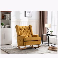 a yellow rocking chair in a living room