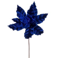 a blue flower is on a stick with some sparkles in it's center