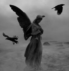 black and white photograph of a woman with two crows flying over her head in the sky