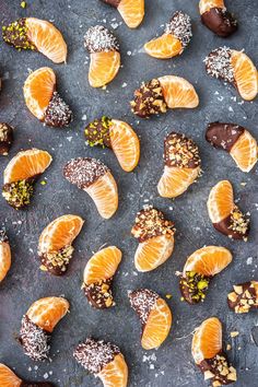 an assortment of candies with nuts and oranges